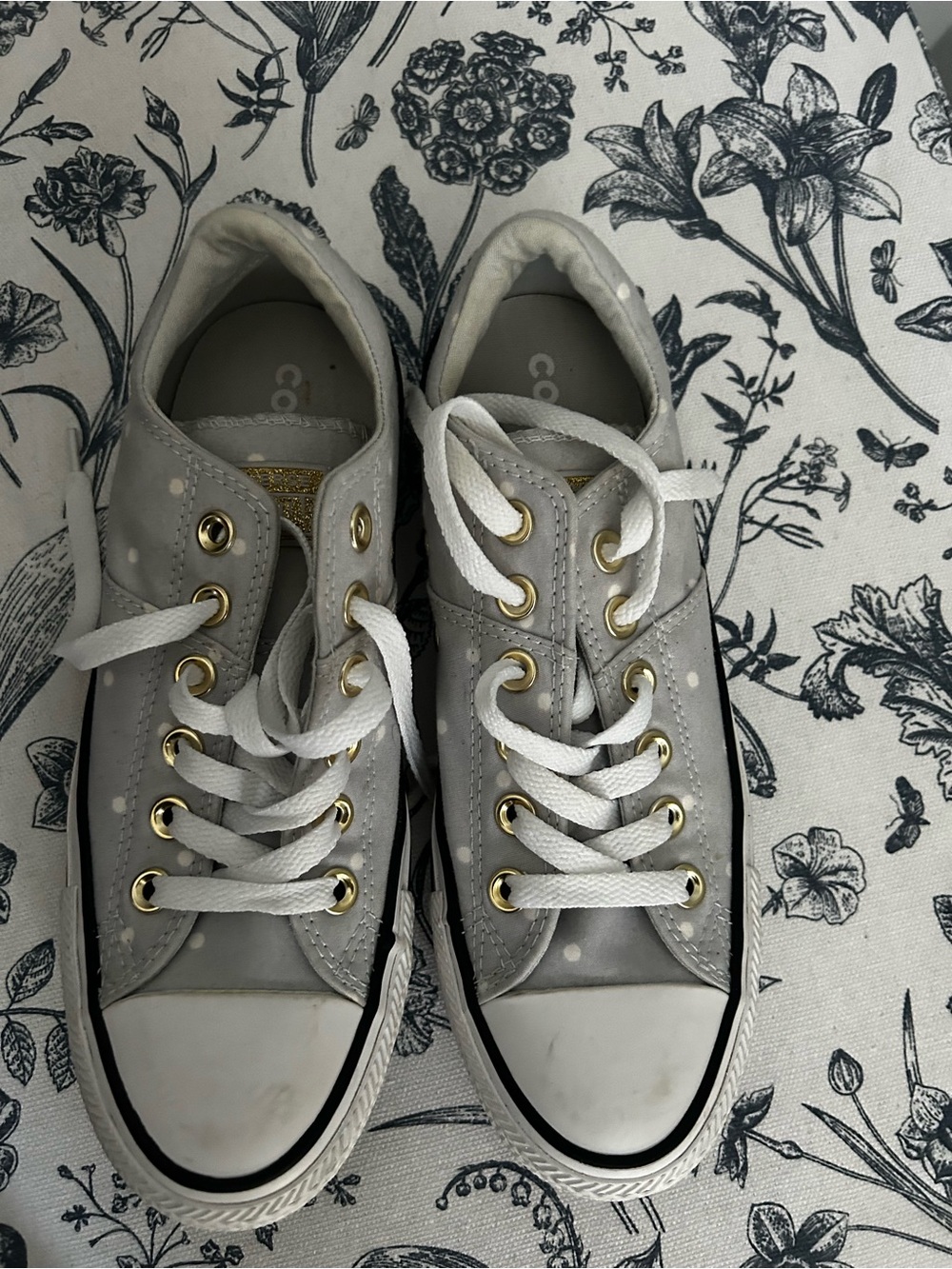 Converse Low-Top Sneakers in Light Blue with white polka dots.
